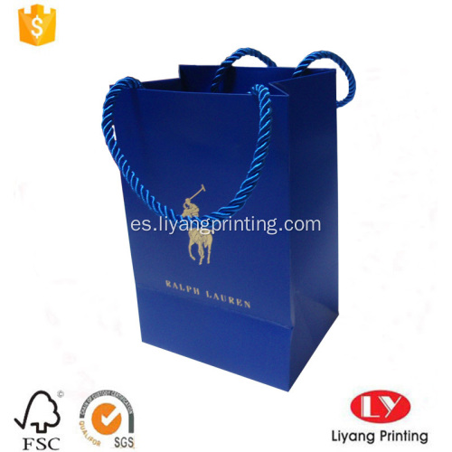 Pequeña bolsa de regalo de papel azul con mango